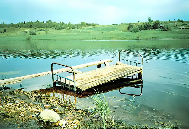 Footbridge made from a bed by an unknown author, 2002, Photograph, 150x100 cm