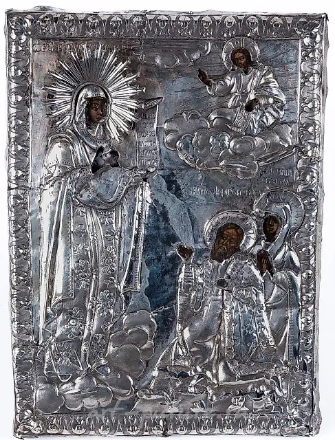 A Russian embossed silver-plated and tempera icon of St. Nicholas...