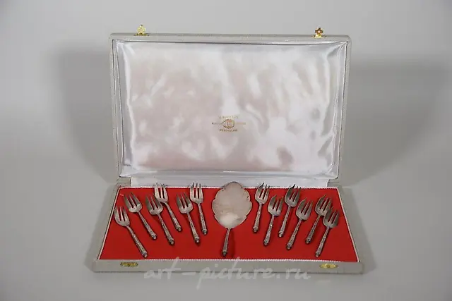 Part of a silver-plated menagerie with net and...