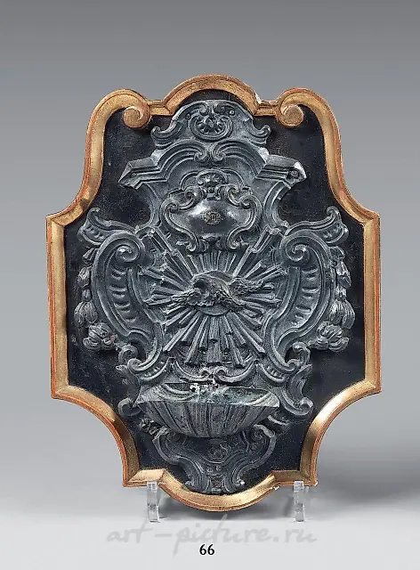 Silver embossed sanctuary lamp with a cherub inside.