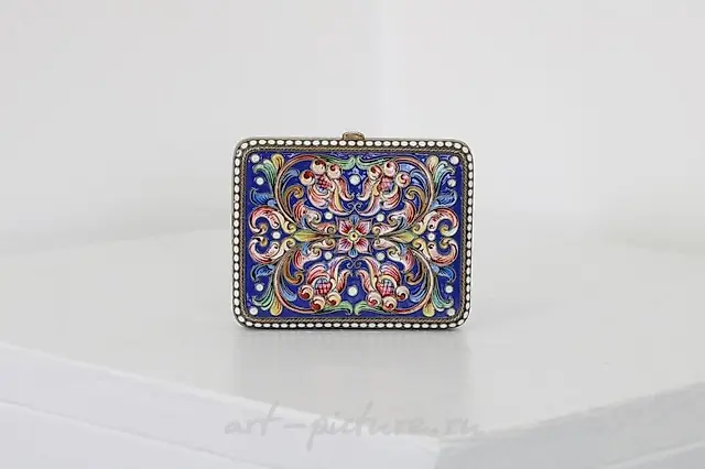 A Russian style silver-gilt and cloisonné powder compact.