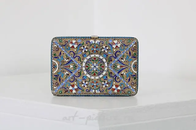 A Russian style silver-gilt and cloisonné cigarette case.