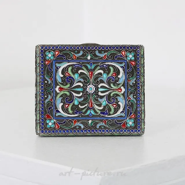 A Russian style silver and cloisonne cigarette case.