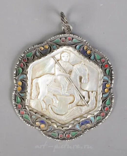 A nineteenth century silver, mother of pearl and garnet pendant...
