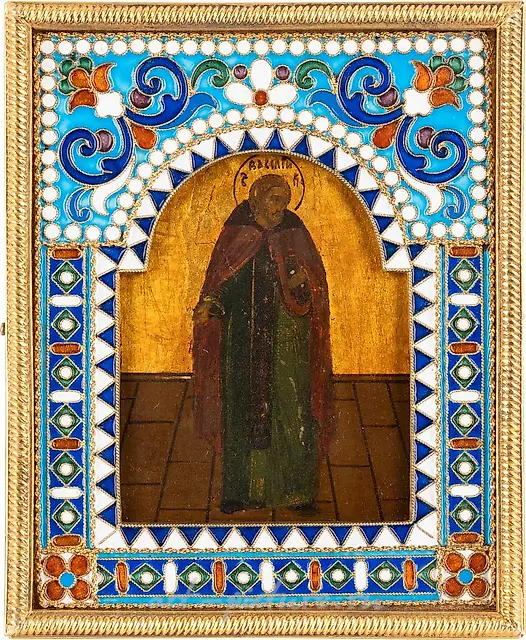 A SMALL ICON SHOWING A MONK WITH A SILVER-GILT...