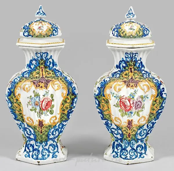 A pair of lidded vases