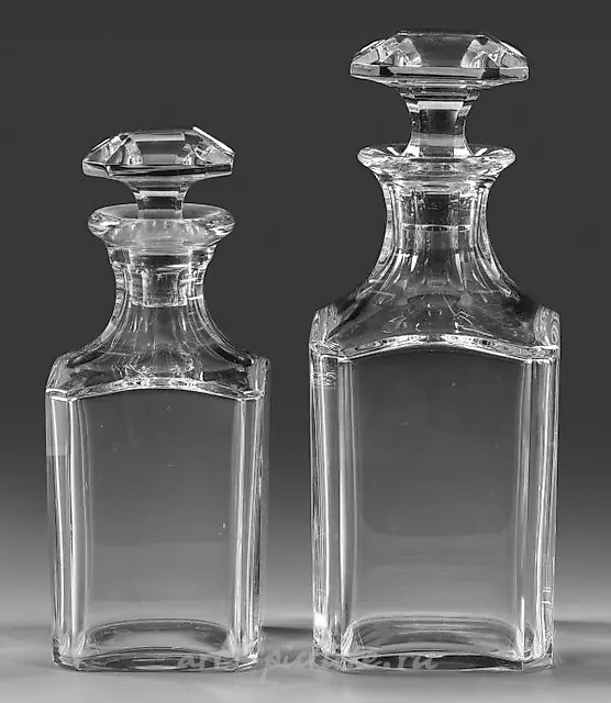 Two Baccarat whisky decanters with stoppers.