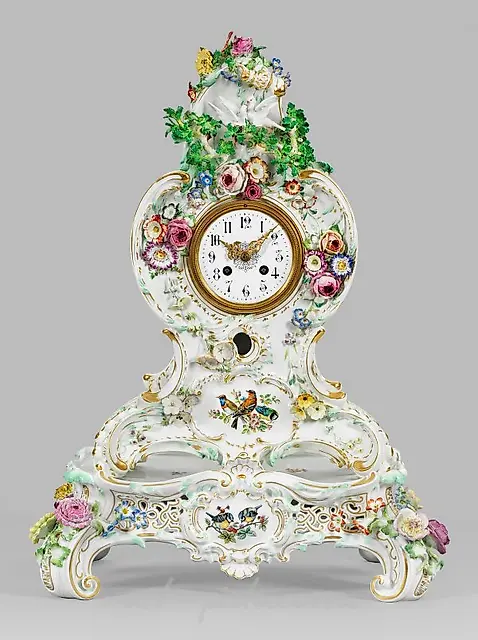 Magnificent Meissen porcelain clock with plastic decoration.
