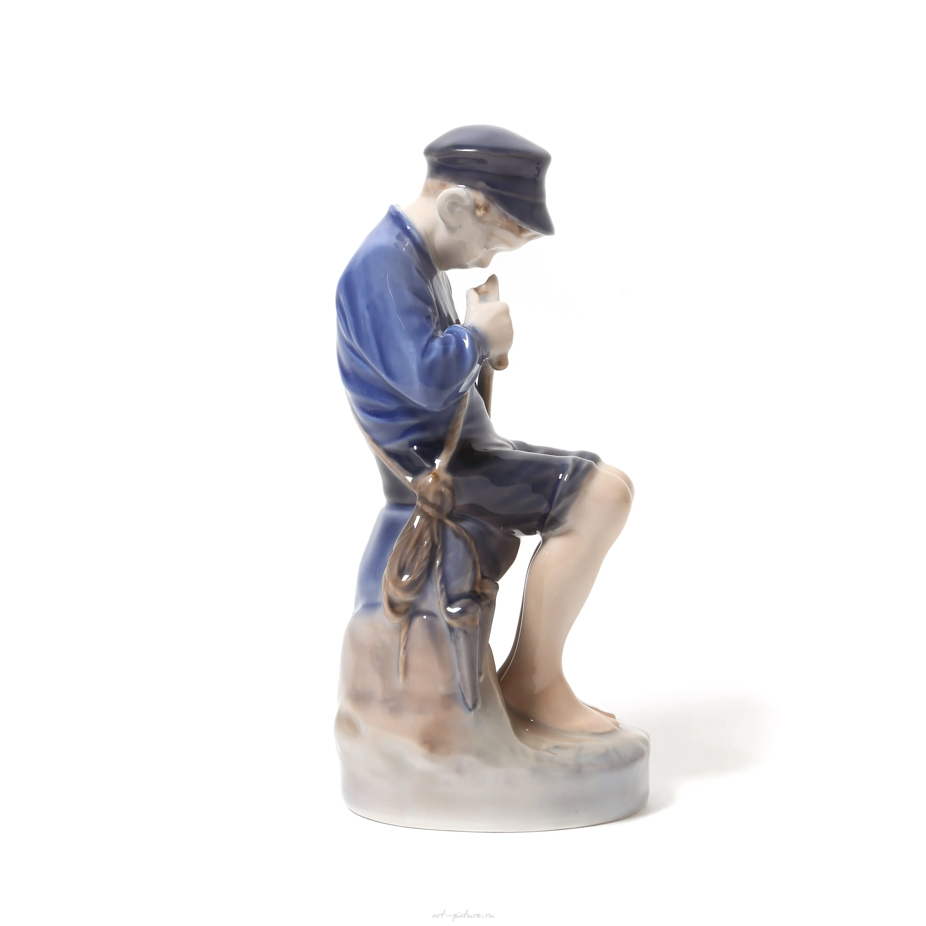 Boy carving a twig. Denmark, Copenhagen, Royal Copenhagen. — photo 2