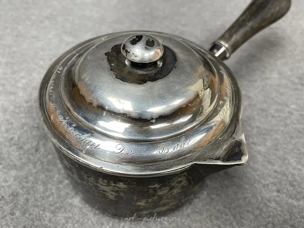 Silver ladle with a wooden handle that has been blackened. Marks... — photo 4
