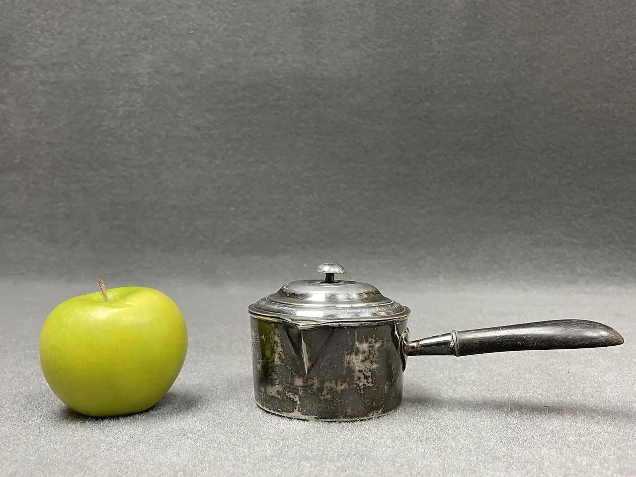 Silver ladle with a wooden handle that has been blackened. Marks... — photo 2