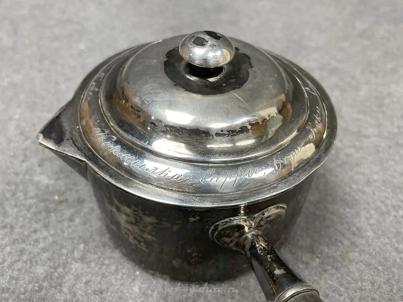 Silver ladle with a wooden handle that has been blackened. Marks... — photo 5