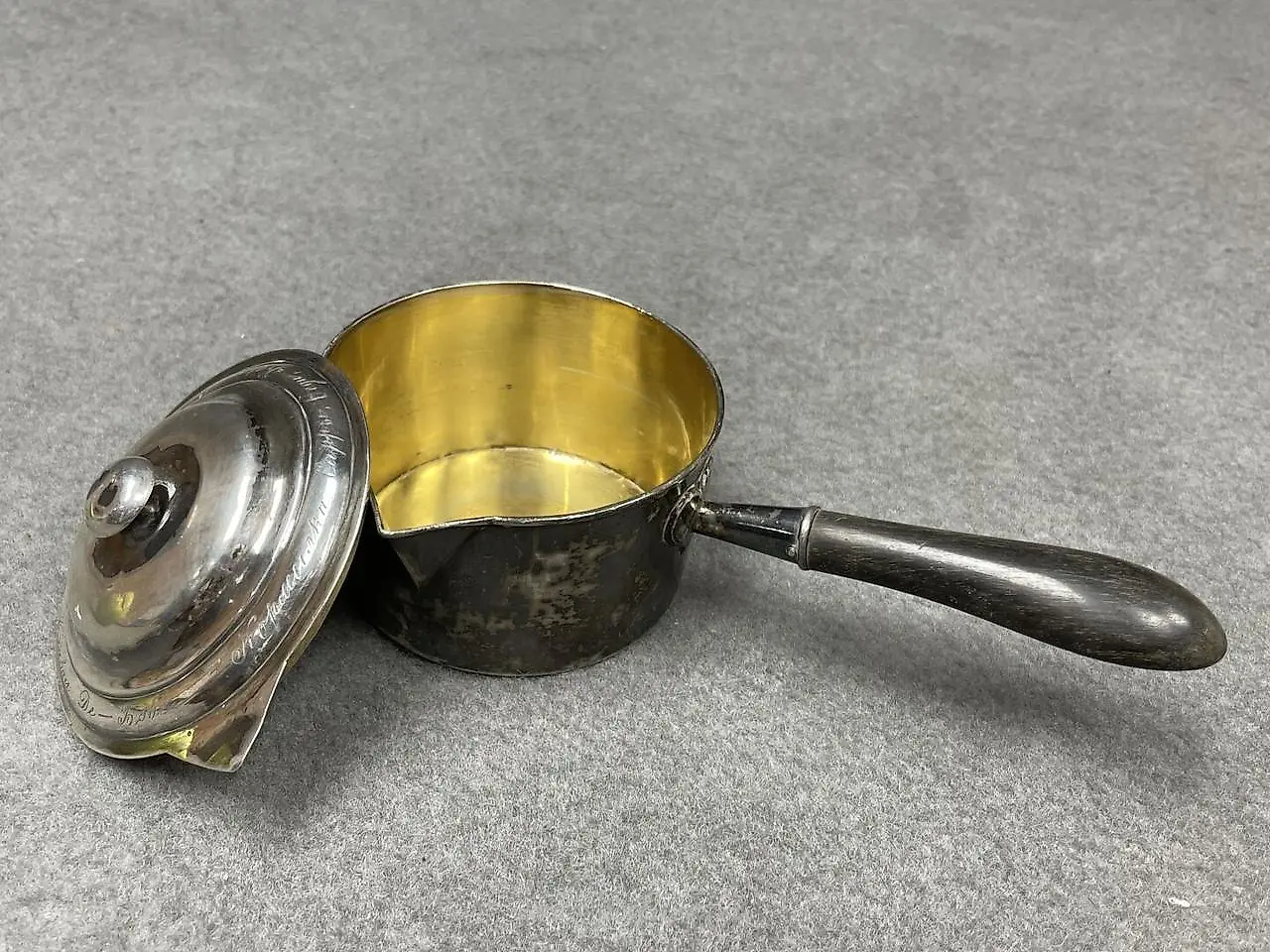 Silver ladle with a wooden handle that has been blackened. Marks... — photo 6