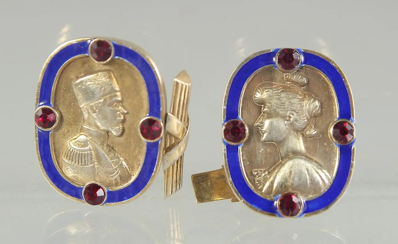 A PAIR OF RUSSIAN SILVER AND BLUE ENAMEL CUFF LINKS with a m...