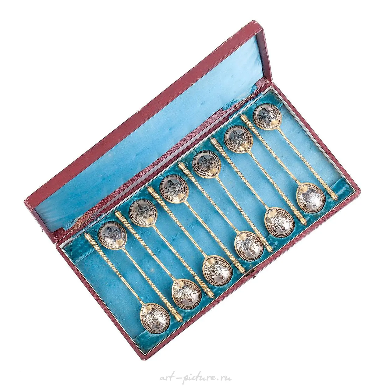 A Russian silver and niello tea spoon set with various designs.