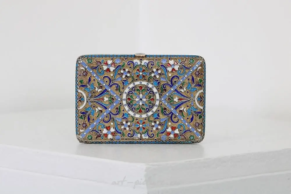 A Russian style silver-gilt and cloisonné cigarette case.