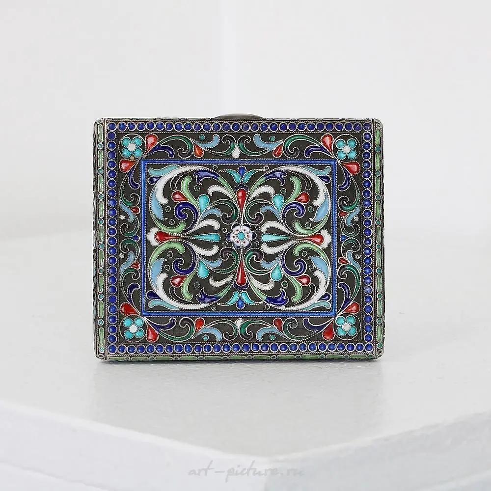 A Russian style silver and cloisonne cigarette case.