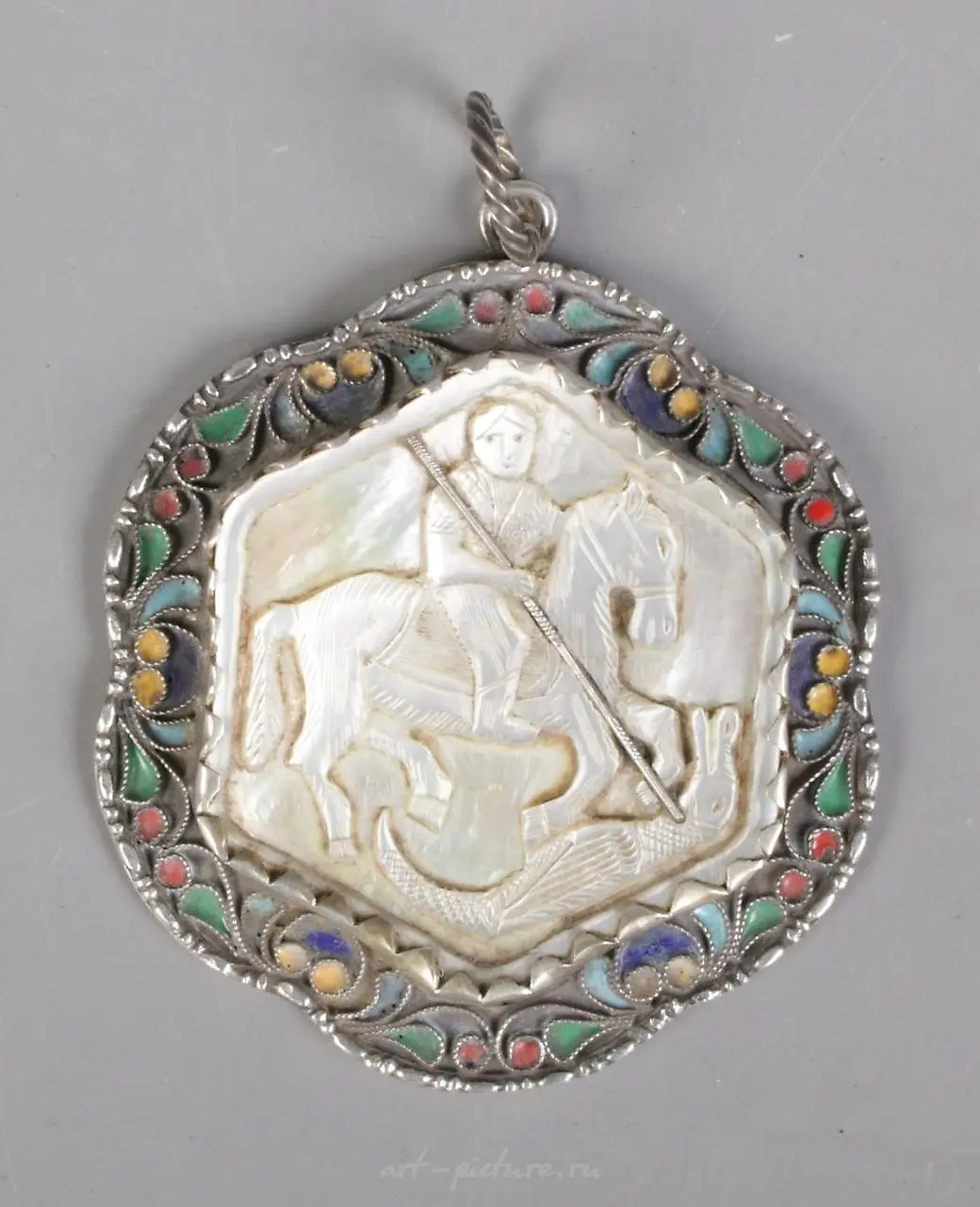 A nineteenth century silver, mother of pearl and garnet pendant...