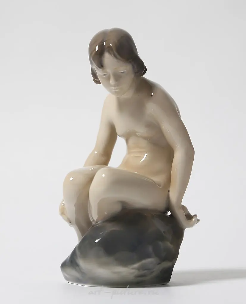 "Girl on a Stone. Denmark, Copenhagen, Royal Copenhagen."