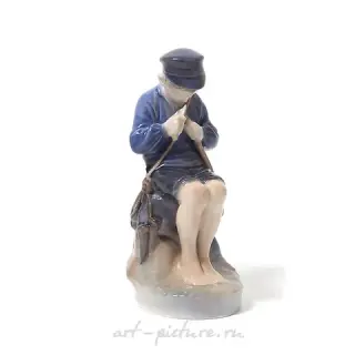 Boy carving a twig. Denmark, Copenhagen, Royal Copenhagen.