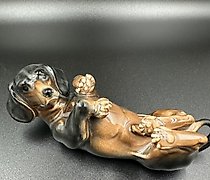buy The figurine of a Dachshund lying on its back, Factory Karl Ens Porzellanfabrik Karl Ens.