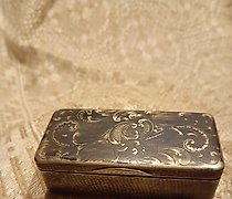 buy The word "Табакерка" translates to "snuffbox" or "tobacco box" in English.