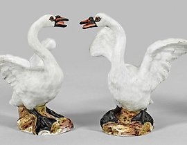 A pair of swan figures as counterparts.