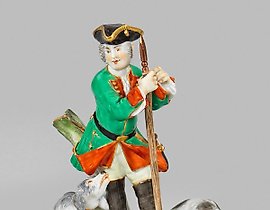 Hunter with dogs and a slain deer