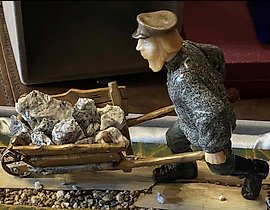 Author's stone sculpture "Miner," Ural school of three-dimensional mosaics.