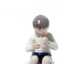 Victor. A boy drinking milk. Denmark, Copenhagen, Bing & Grondahl.