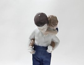 The translation of the text is: "Rider. Denmark, Copenhagen, Bing & Grondahl."