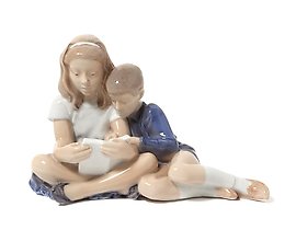 Children reading. Denmark, Copenhagen, Royal Copenhagen.