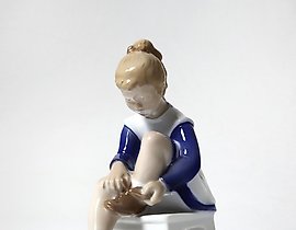 Porcelain figurine (statuette) Marianna. A girl is tying shoelaces Bing Grondahl.