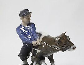 The boy with the calf. Denmark, Copenhagen, Royal Copenhagen.