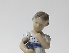 The girl with a doll. Denmark, Copenhagen, Royal Copenhagen.