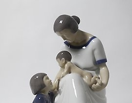 "Mother with two children. Denmark, Copenhagen, Bing & Grondahl."