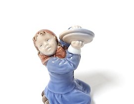 The girl with the plates. Denmark, Copenhagen, Royal Copenhagen.
