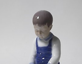 "Boy with a bucket. Denmark, Copenhagen, Bing & Grondahl."