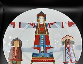 The plate is a national costume with hand-painted artwork by Olga Serebryakova, a leading artist at IFZ.