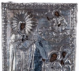 A Russian embossed silver-plated and tempera icon of St. Nicholas...