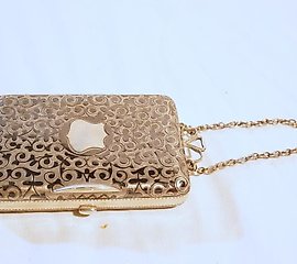 An antique Russian silver & Niello ladies purse on chain having...