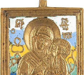 A LARGE BRASS AND ENAMEL ICON SHOWING THE SMOLENSKAYA MOTHER...