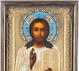 AN ICON SHOWING CHRIST PANTOKRATOR WITH A SILVER-GILT AND CLOTH