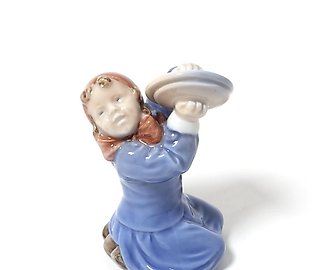 The girl with the plates. Denmark, Copenhagen, Royal Copenhagen.