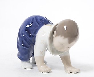 Crawling baby. Denmark, Copenhagen, Royal Copenhagen.