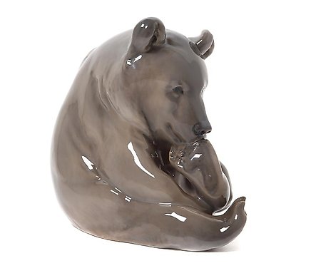 棕熊在吮吸爪子。丹麦，哥本哈根，皇家哥本哈根，1923年。