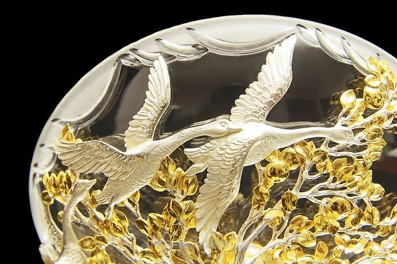 The translation of "Ваза «Гуси-Лебеди»" into English is "Vase 'Geese-Swans'."