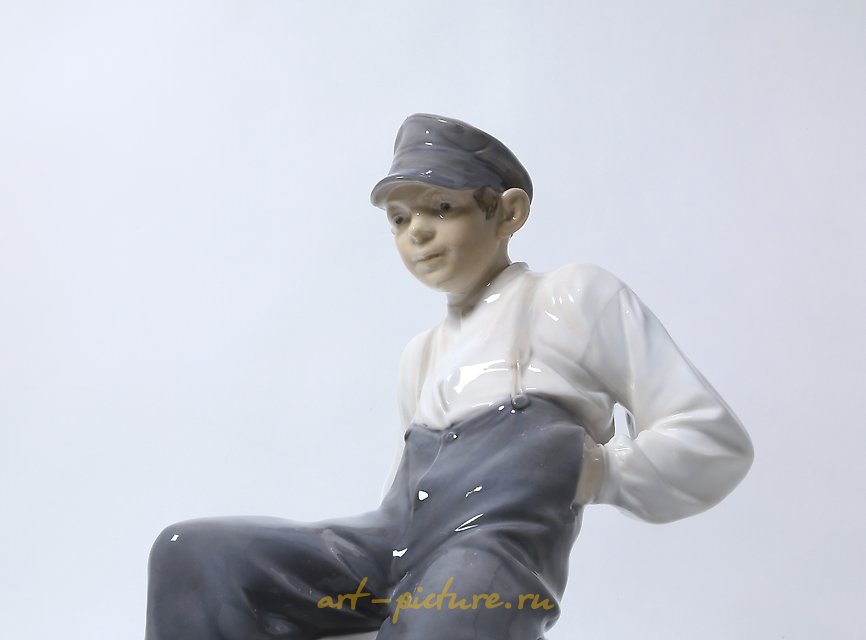 "Boy on a stone. Denmark, Copenhagen, Royal Copenhagen."