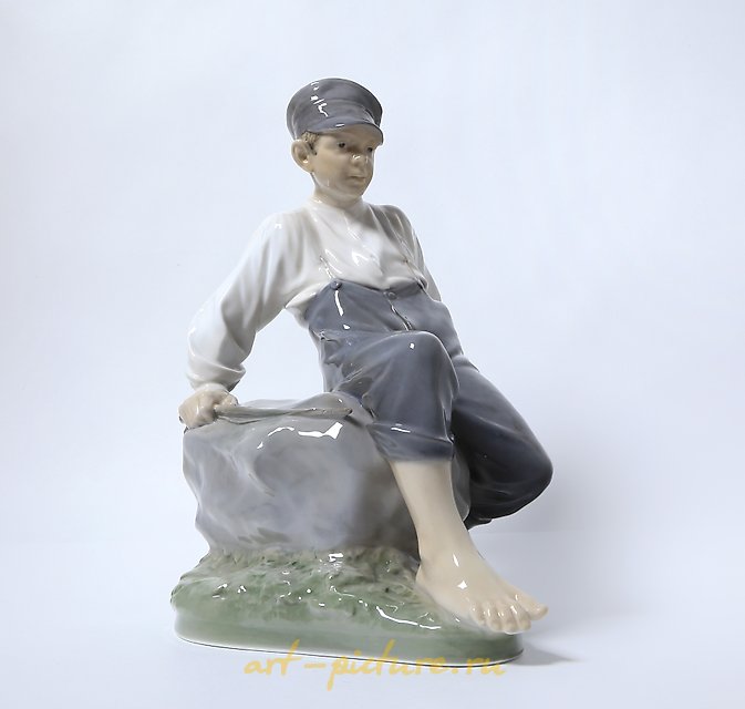 "Boy on a stone. Denmark, Copenhagen, Royal Copenhagen."