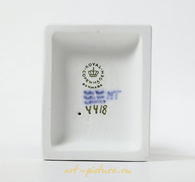 A woman with a basket of eggs on her head. Denmark, Copenhagen, Royal Copenhagen.